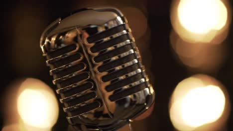 captivating close-up of a vintage microphone radiating charm and elegance, perfectly illuminated by soft background lights in a dimly lit setting