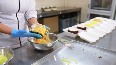 cake decorating process in a commercial kitchen