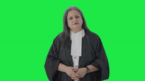 Indian-senior-female-lawyer-looking-to-the-camera-Green-screen