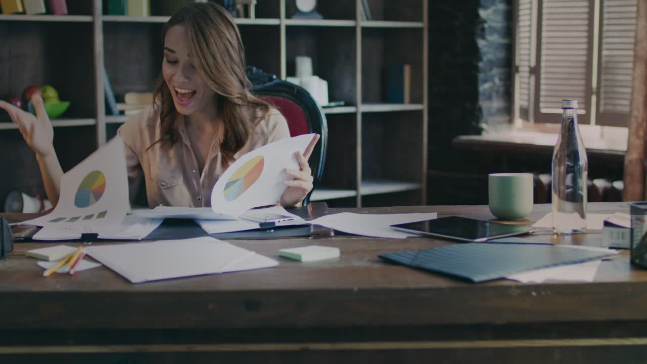 Successful business woman reading data report. Happy businesswoman working