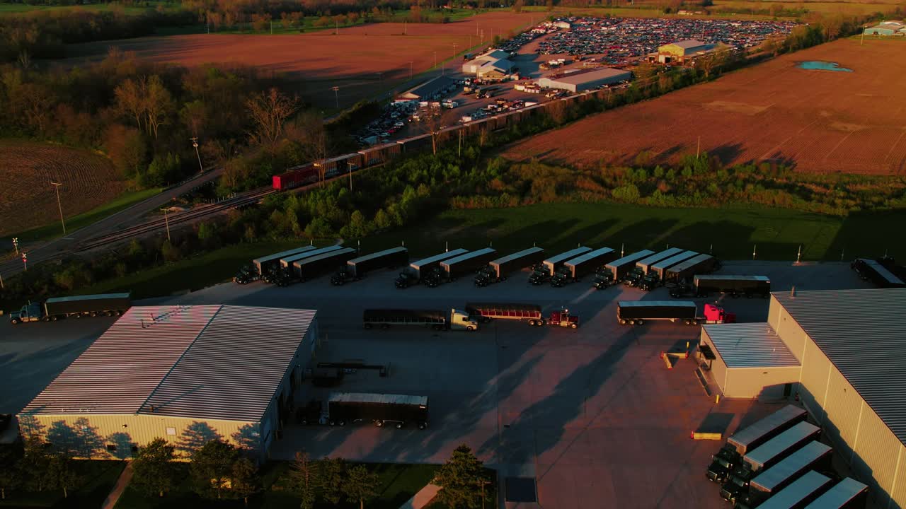 Conestoga Trucking Terminal at Sunrise – Aerial View of Fleet and Warehouse Operations in Rura Kenton, Ohio, USA