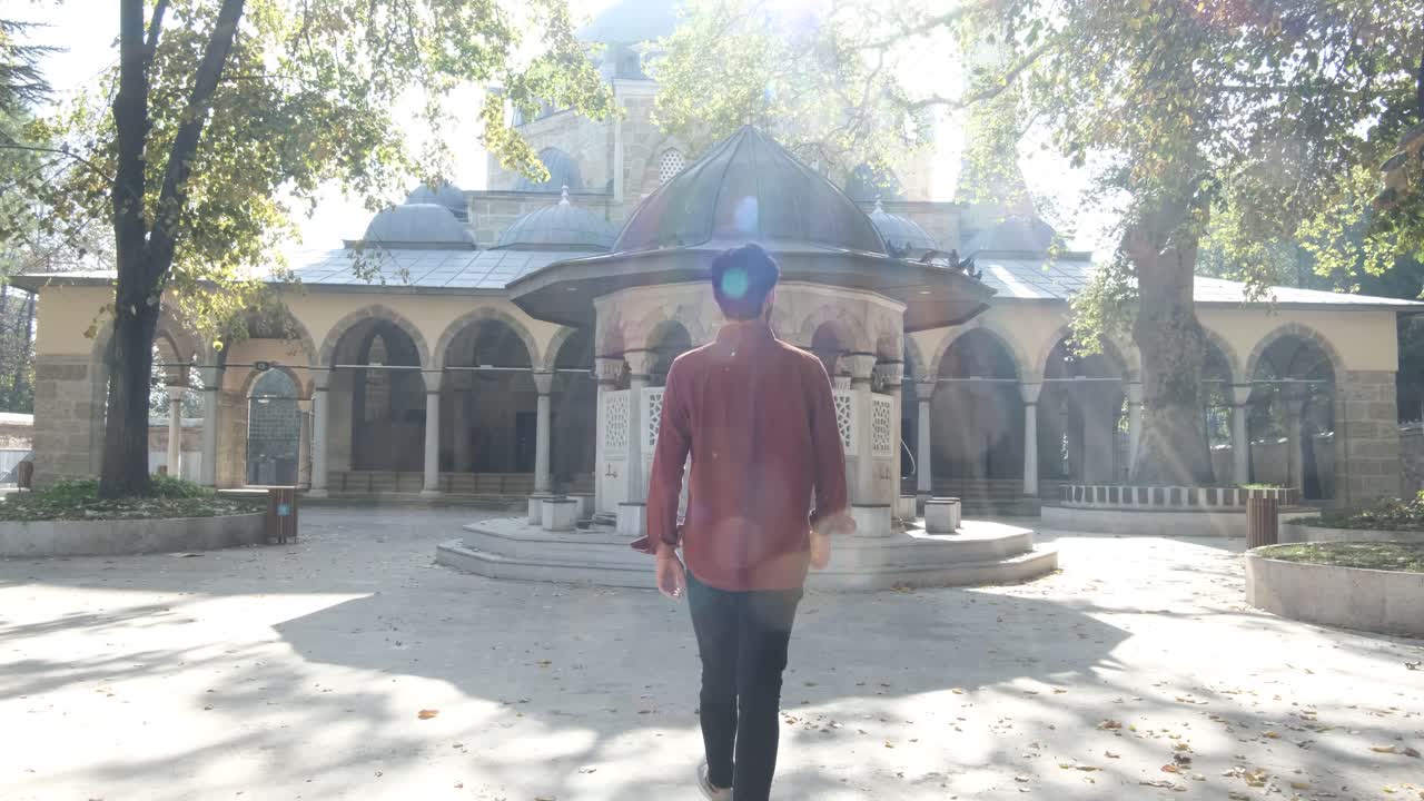 Man Coming Out of Mosque