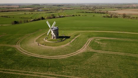 landmark chesterton historic windmill aerial view orbit right across english rural countryside agricultural field landscape