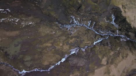 top down aerial view river veins on volcanic mountain eyafjöll in iceland