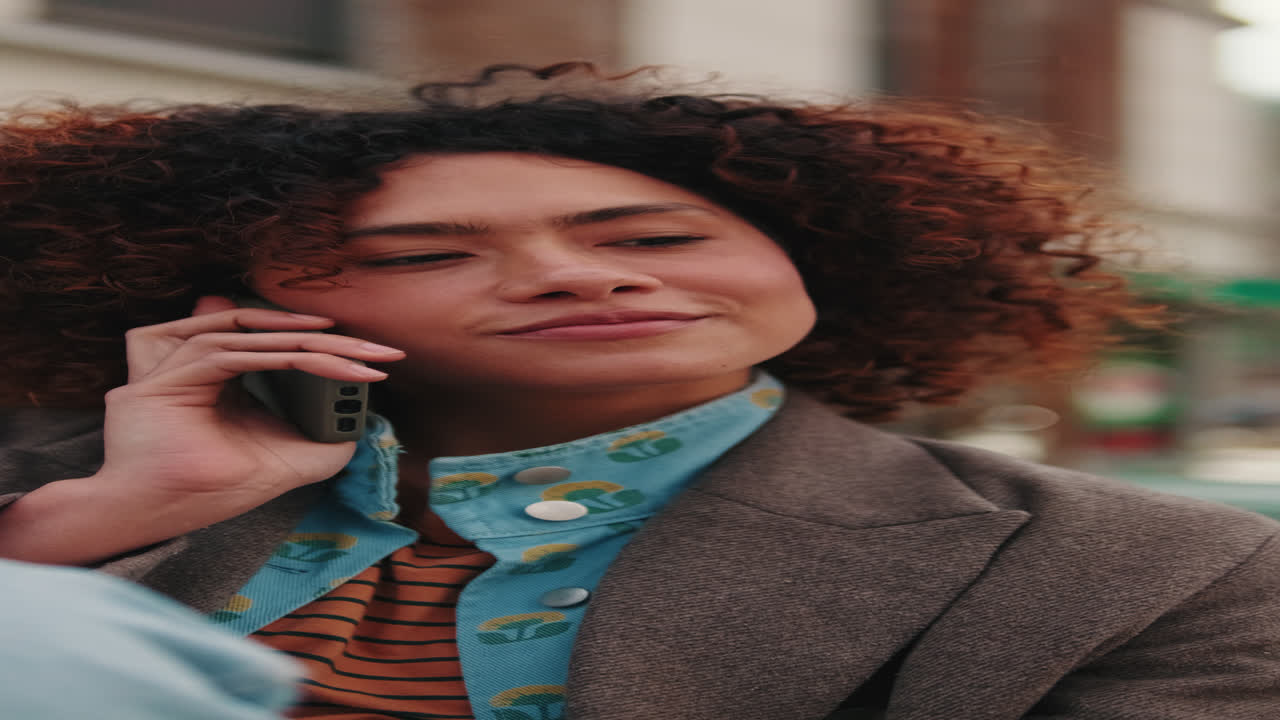 Young Woman Talking on Phone Outdoors