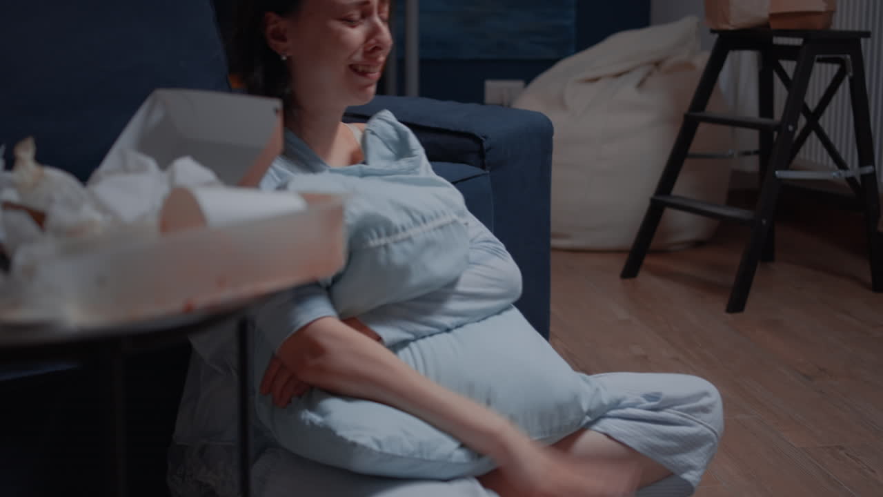 Devastated young woman crying reading letter debt notification
