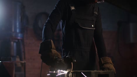 blacksmith at work in a dark workshop