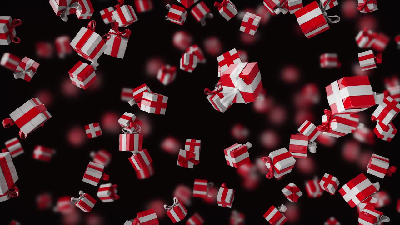 Gift boxes falling from top to bottom on a black background with depth of field. Bright red white festive background.