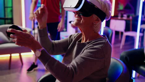 elderly woman and friends enjoying a virtual reality gaming session