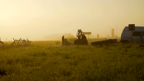 preparation of the balloon basket for flight, early morning in the field. the dew on the grass and the soft rays of the sun 4k