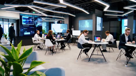 modern office environment with professionals working and digital displays