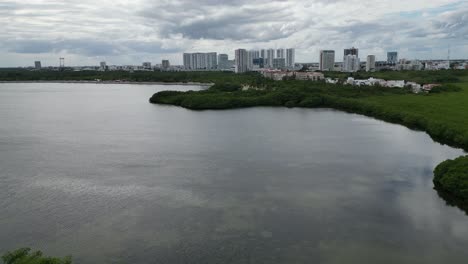 flyover shallow nichupte lagoon toward cancun mexico under cloud
