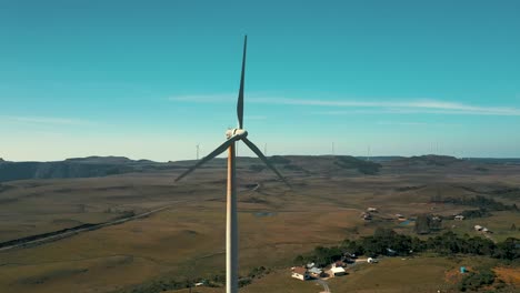 Near-wind-turbine-generator-aerial-view-located-in-Santa-Catarina,-Brazil