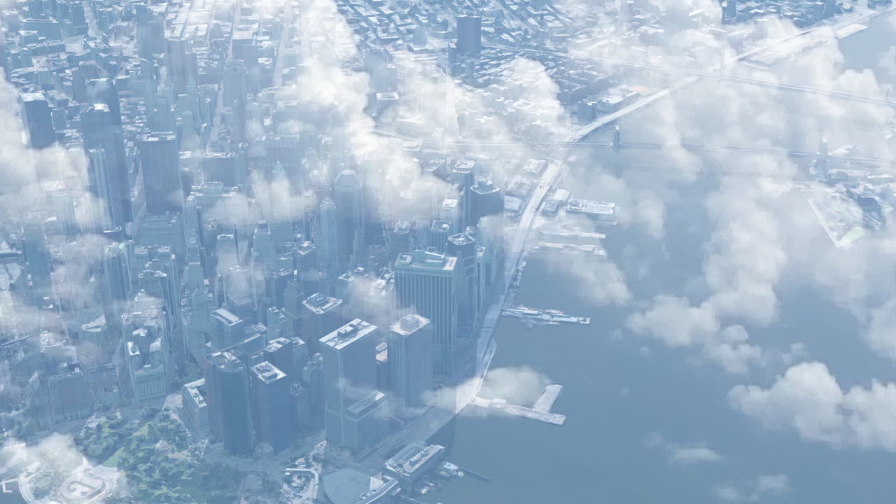 Aerial View of a City Skyline Through Clouds