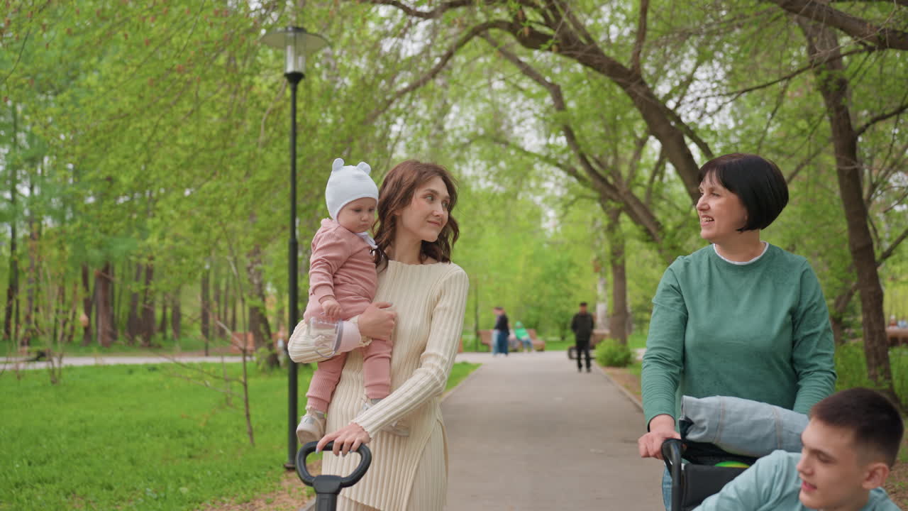 Group Walking Happily In Park, Friendly Women United Walking Peacefully Through Green Spaces, Families And Groups Enjoying Nature And Outdoor Activities In Relaxing Park Environments