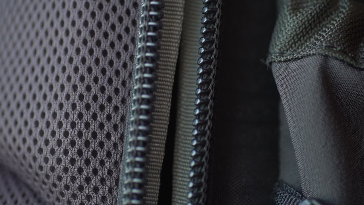 Macro footage of a backpack zipper