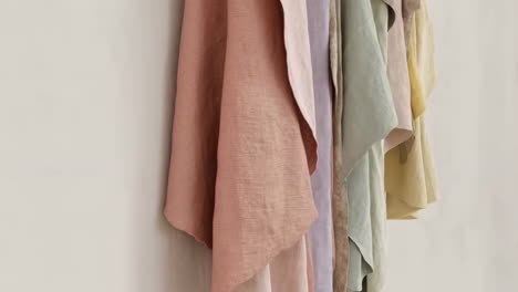 collection of hanging pastel colored fabrics