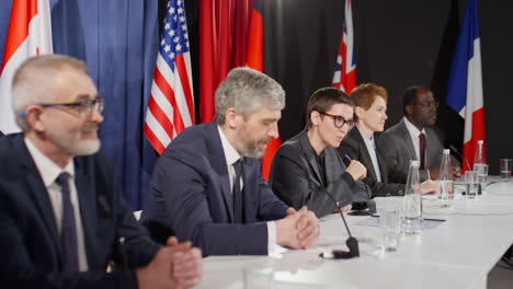 female politician holding speech at international press conference