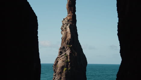 formation of high rock with characteristic shape at mirador ilheus da ribeira da janela on the north coast of madeira island portugal - tilt up shot