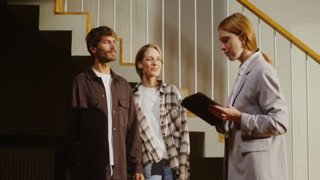 couple viewing a property with a real estate agent