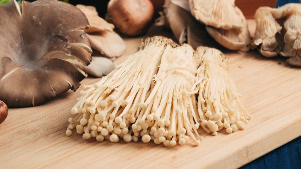 Various Types of Mushrooms on Wooden Cutting Board