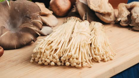 various types of mushrooms on wooden cutting board