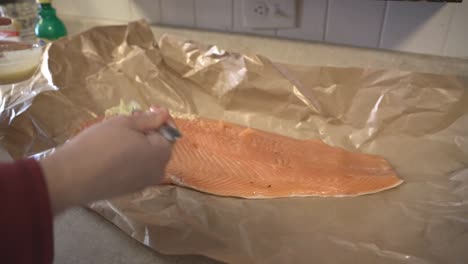 Preparing-a-large-salmon-filet-for-cooking