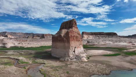 Lone-Rock-During-Low-Tide-In-Wahweap-Bay,-Lake-Powell