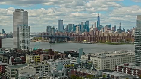 Zoom-in-drone-shot-of-Skyline-with-One-World-Trade-Center-and-Williamsburg-Bridge-and