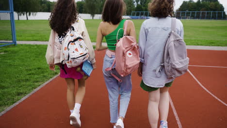 three friends on the schoolyard