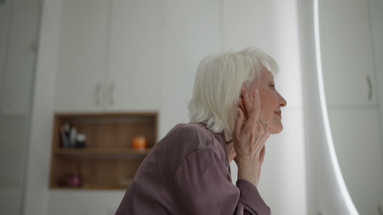 Senior Woman in Front of Mirror