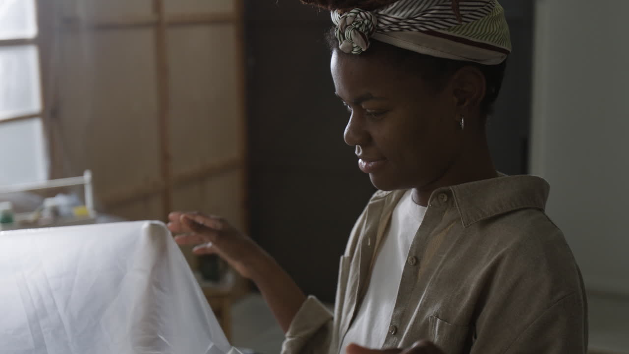 Woman with headwrap indoors