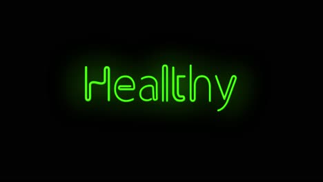 flashing neon green healthy sign on black background on and off with flicker