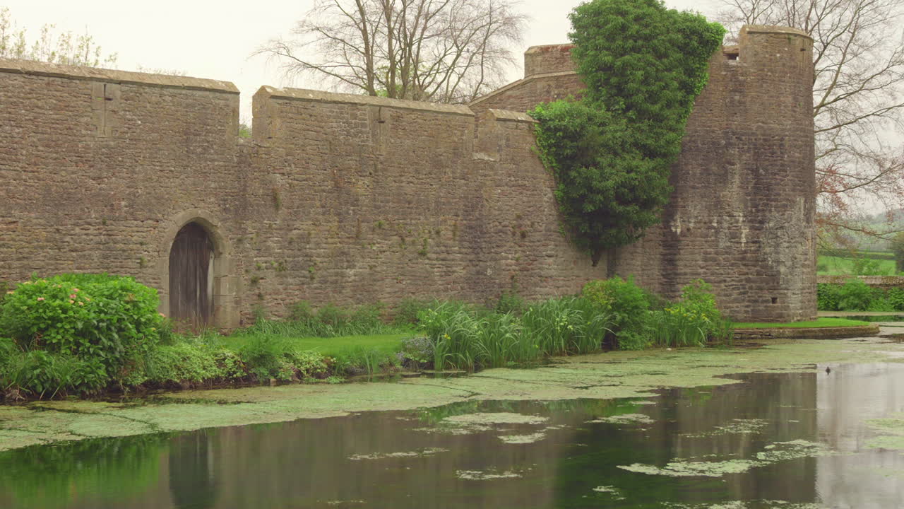 River protecting the walls of Bishop's Palace in Wells.