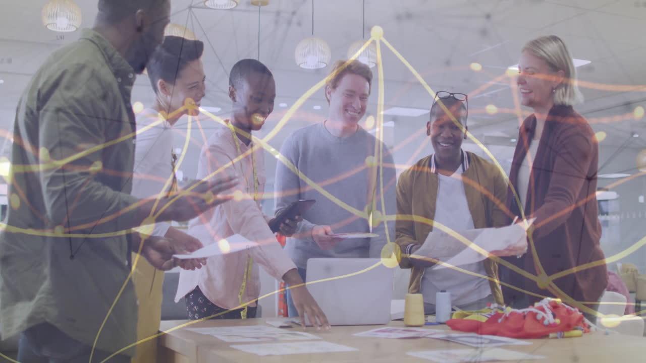 Diverse team collaborating in office with network connections animation overlay