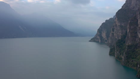 Dolly-in-aerial-shot-of-the-majestic-mountains-near-Lago-Di-Garda,-Italy