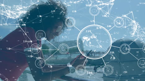 globe of network of connections against african american woman using smartphone