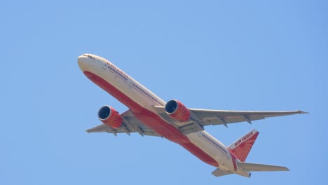 plane takes off from toronto international airport, flies in blue sky during the day