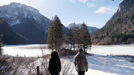 lago del predil, tarvisio - italy a frozen alpine lake in a snow-covered winter fairytale mountain landscape