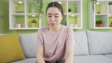 asian young woman with anxiety disorder scared at home alone.