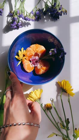 delicate floral arrangement with mandarin oranges