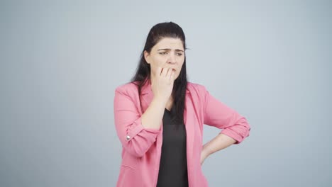 stressed business woman biting nails.