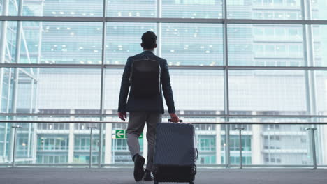 business man, back and window at airport