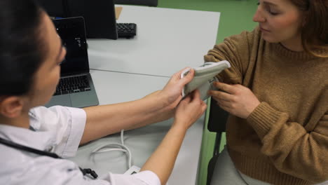 doctor measuring patient's blood pressure