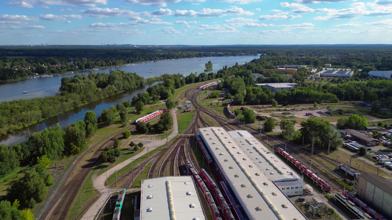 Hennigsdorf railway factory train depot overlooking the river in Brandenburg, Germany. Beautiful aerial view flight panorama overview drone