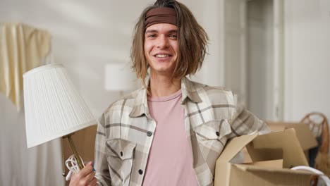 happy young man moving into a new home