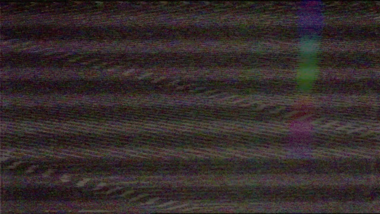 VHS screen digital glitch and noise. Videotape rewind mode. Black white static noise motion.old film grunge on black background realistic flickering