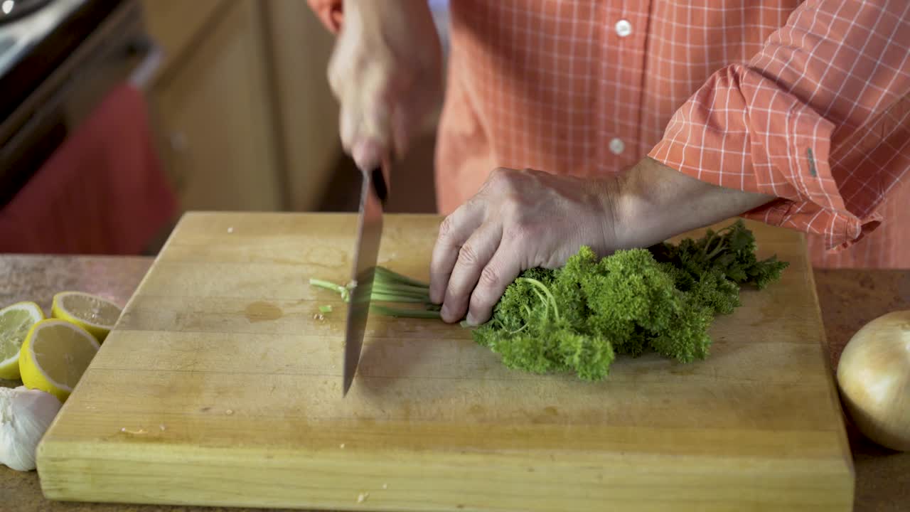 Chopping parsley on a cutting board