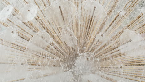 A-Close-Up-Of-A-Detail-Of-A-Fountain---Water-Flows-From-Thin-Pipes-Background-Of-Water-Jets