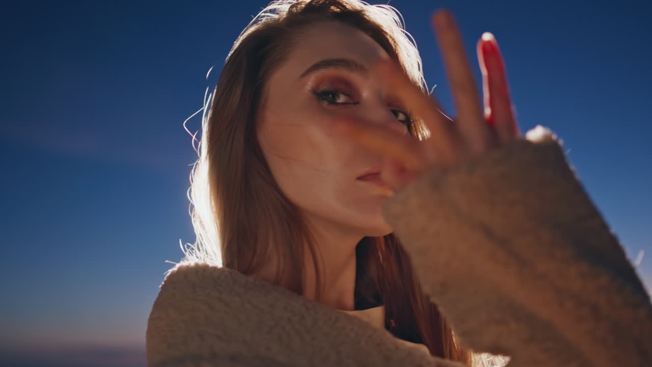 Festive woman clubbing sunset at outdoors party closeup. Night girl moving arms